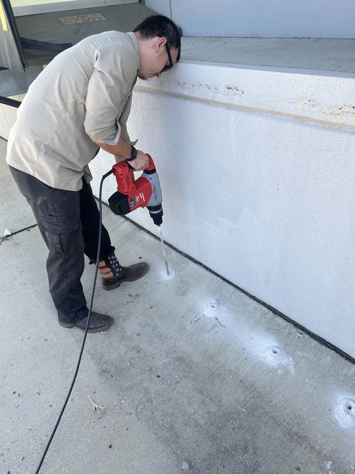 Termite treatment drilling into concrete
